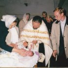 О.Герман совершает таинство крещения 